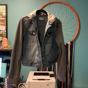 Denim jacket with grey knot sleeves and detachable hood